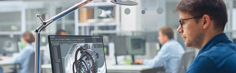 Photo of a person working on a laptop